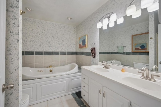 897 Deer Path Rd, Dillon, CO 80435 - bathroom featuring toilet, a bath, tile patterned floors, double vanity, and tile walls