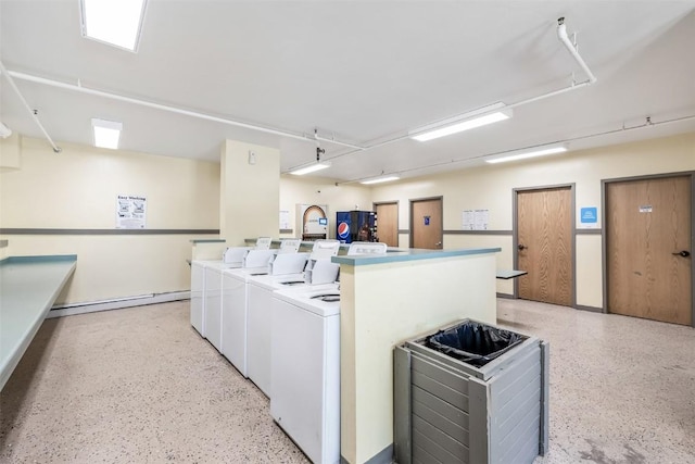 2200 Lodgepole Cir Unit 308, Silverthorne, CO 80498 - shared laundry area with separate washer and dryer and a baseboard heating unit