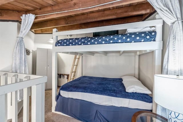 2200 Lodgepole Cir Unit 308, Silverthorne, CO 80498 - bedroom featuring beamed ceiling, wooden ceiling, and carpet