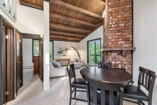 2200 Lodgepole Cir Unit 308, Silverthorne, CO 80498 - dining space featuring light colored carpet, lofted ceiling with beams, a baseboard heating unit, and wooden ceiling