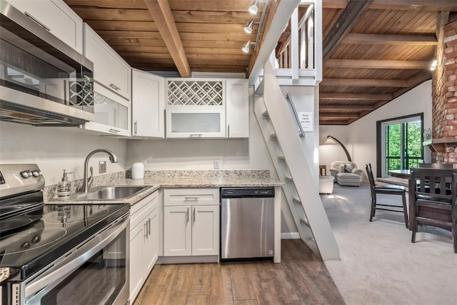 2200 Lodgepole Cir Unit 308, Silverthorne, CO 80498 - kitchen with beam ceiling, appliances with stainless steel finishes, wooden ceiling, and a sink