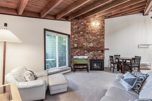 2200 Lodgepole Cir Unit 308, Silverthorne, CO 80498 - living area featuring wooden ceiling, beam ceiling, carpet, and a fireplace