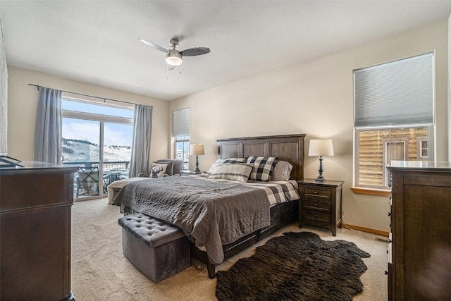 carpeted bedroom with ceiling fan and access to exterior