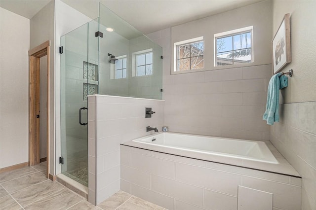 bathroom with separate shower and tub