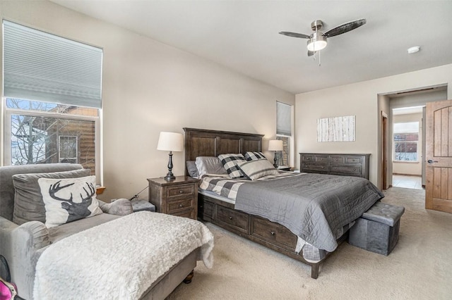 bedroom featuring ceiling fan and light carpet