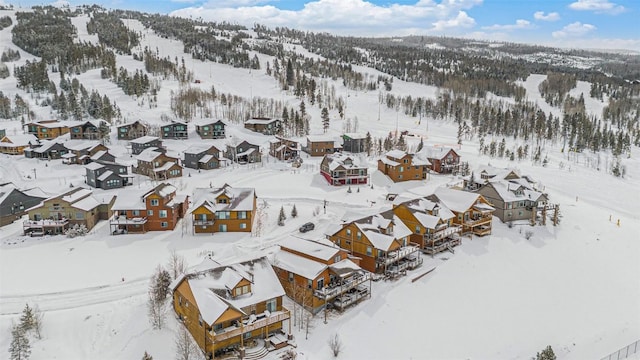 snowy aerial view featuring a mountain view