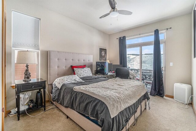 carpeted bedroom with access to exterior and ceiling fan