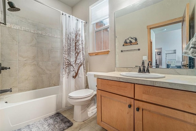 full bathroom featuring shower / tub combo with curtain, vanity, tile patterned floors, and toilet