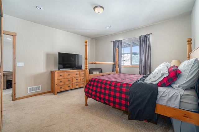 bedroom featuring light colored carpet