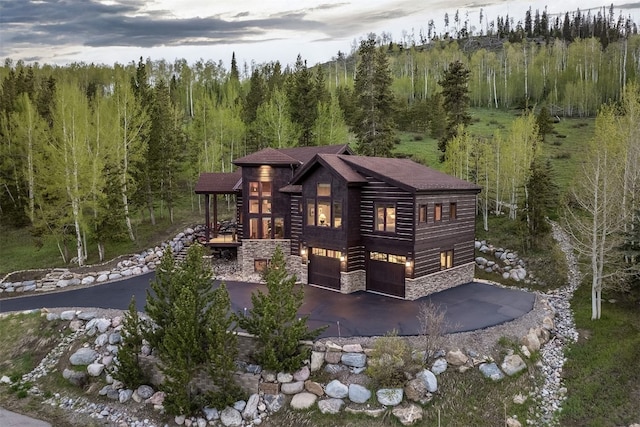 2655 Hunters Knob Rd, Silverthorne, CO 80498 - view of front of home featuring stone siding and a forest view