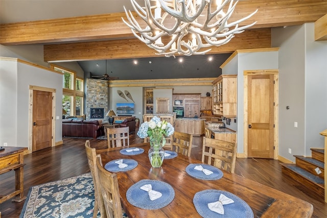 2655 Hunters Knob Rd, Silverthorne, CO 80498 - dining area featuring dark wood-type flooring, stairs, a chandelier, a ceiling fan, and baseboards