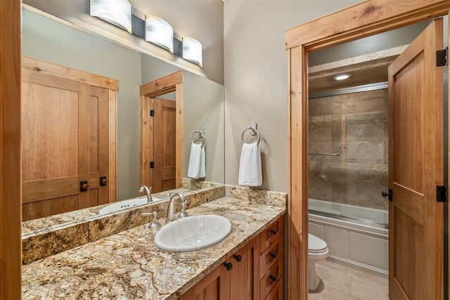 2655 Hunters Knob Rd, Silverthorne, CO 80498 - bathroom featuring toilet, vanity, enclosed tub / shower combo, and tile patterned floors