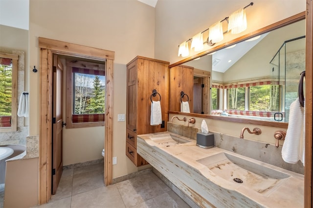 2655 Hunters Knob Rd, Silverthorne, CO 80498 - bathroom with healthy amount of natural light, a bath, double vanity, and high vaulted ceiling