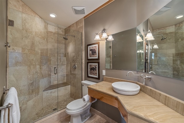 2655 Hunters Knob Rd, Silverthorne, CO 80498 - bathroom with a stall shower, toilet, vanity, and recessed lighting