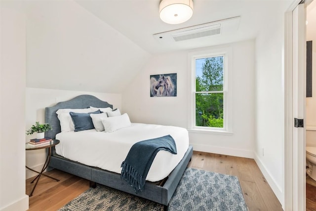 24 Maple St, Steamboat Springs, CO 80487 - bedroom with hardwood / wood-style floors, vaulted ceiling, and baseboards