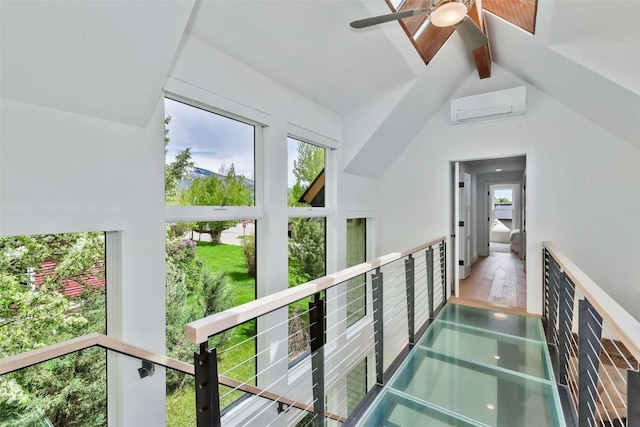 24 Maple St, Steamboat Springs, CO 80487 - hallway featuring a wall mounted AC, beamed ceiling, and high vaulted ceiling