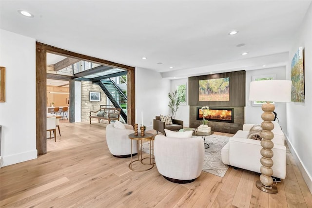 24 Maple St, Steamboat Springs, CO 80487 - living room with light wood-style floors, baseboards, a large fireplace, and recessed lighting