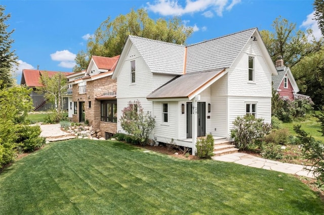 24 Maple St, Steamboat Springs, CO 80487 - rear view of house featuring a yard and stone siding