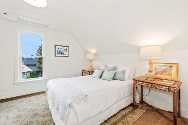 24 Maple St, Steamboat Springs, CO 80487 - bedroom featuring light wood finished floors, lofted ceiling, and baseboards