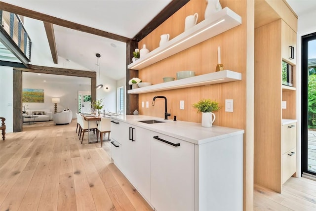 24 Maple St, Steamboat Springs, CO 80487 - kitchen with a sink, open shelves, modern cabinets, and light countertops