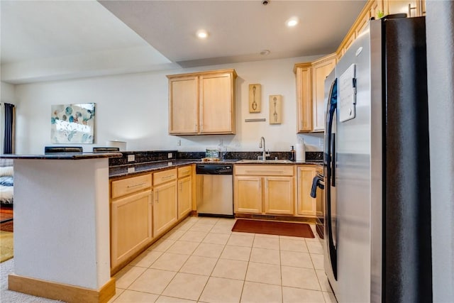 135 Main St Unit 202, Dillon, CO 80435 - kitchen featuring appliances with stainless steel finishes, light brown cabinets, a peninsula, and recessed lighting