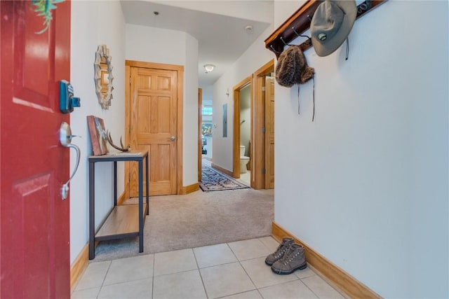 135 Main St Unit 202, Dillon, CO 80435 - foyer entrance featuring light carpet and light tile patterned flooring