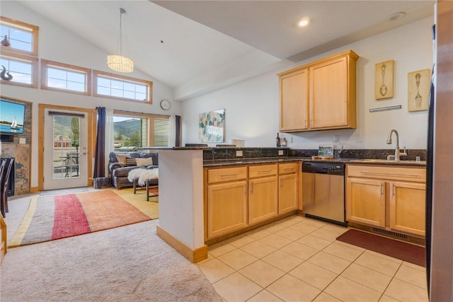 135 Main St Unit 202, Dillon, CO 80435 - kitchen with stainless steel dishwasher, open floor plan, a peninsula, light tile patterned floors, and pendant lighting