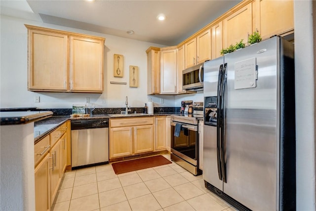 135 Main St Unit 202, Dillon, CO 80435 - kitchen featuring stainless steel appliances, light brown cabinets, recessed lighting, light tile patterned floors, and a peninsula
