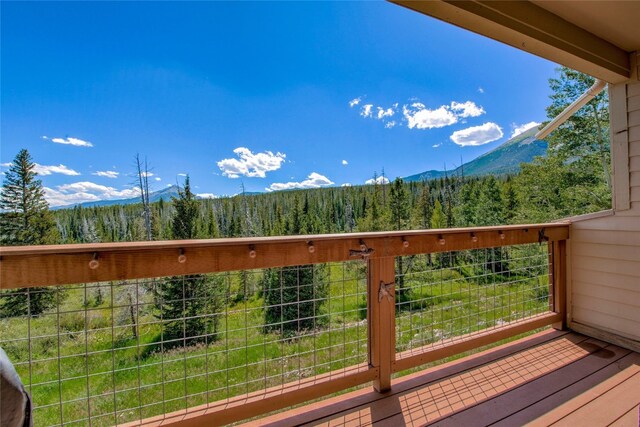 exterior space with a wooded view