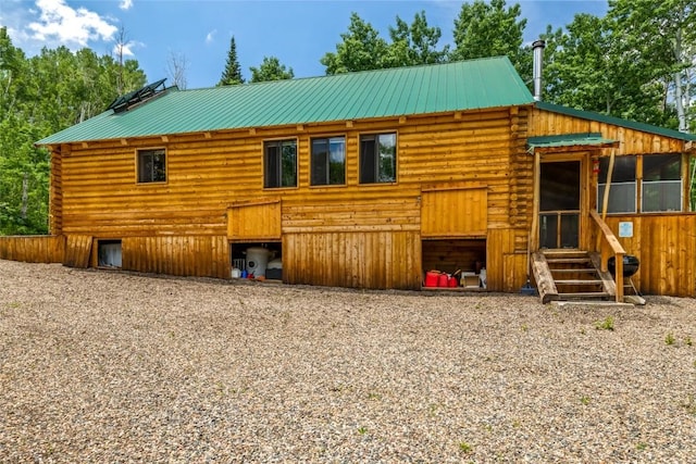 389 Routt Forest Loop, Craig, CO 81625 - back of house featuring log exterior and a metal roof