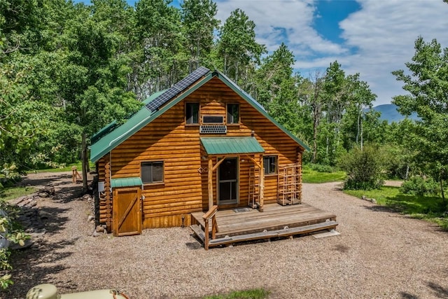 389 Routt Forest Loop, Craig, CO 81625 - rear view of house featuring log siding and a deck