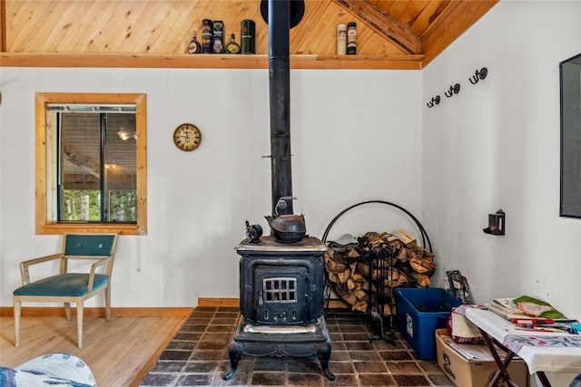 389 Routt Forest Loop, Craig, CO 81625 - living area featuring a wood stove and wood ceiling