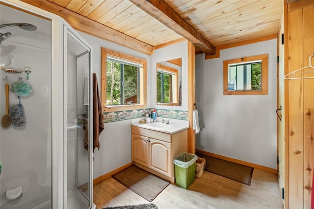 389 Routt Forest Loop, Craig, CO 81625 - bathroom with a wooden ceiling with exposed beams, vanity, wood finished floors, and a stall shower