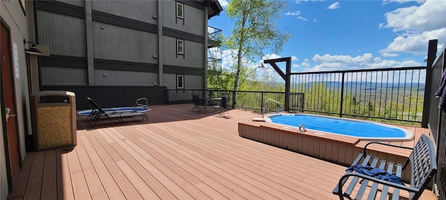 view of pool with a deck