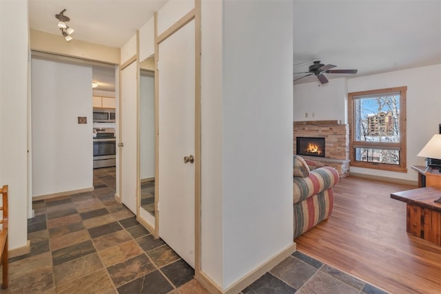 2590 Longthong Rd Unit 211, Steamboat Springs, CO 80487 - corridor with dark stone finish flooring and baseboards
