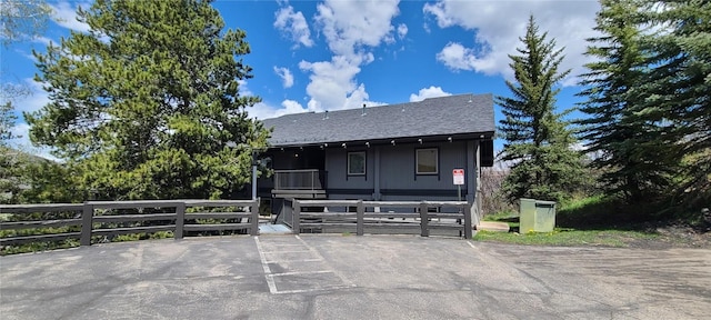 view of front of property with a shingled roof