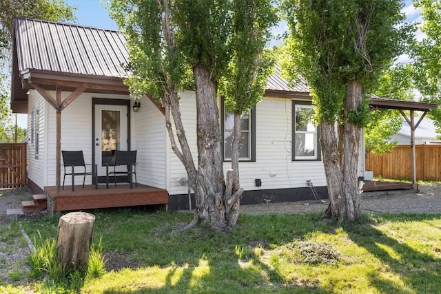 225 N Poplar St, Hayden, CO 81639 - rear view of house with metal roof