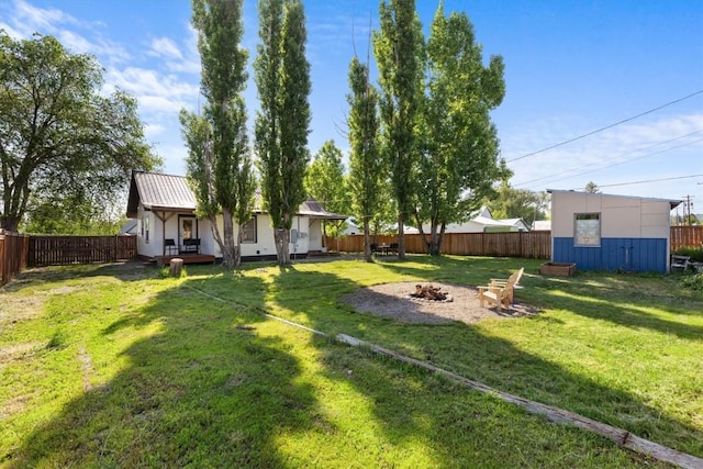 225 N Poplar St, Hayden, CO 81639 - view of yard with a fire pit and an outbuilding