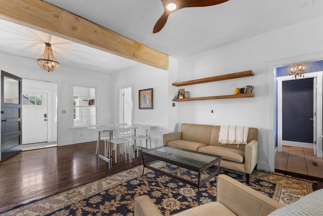 225 N Poplar St, Hayden, CO 81639 - living area with a chandelier, wood finished floors, ceiling fan, beamed ceiling, and baseboards