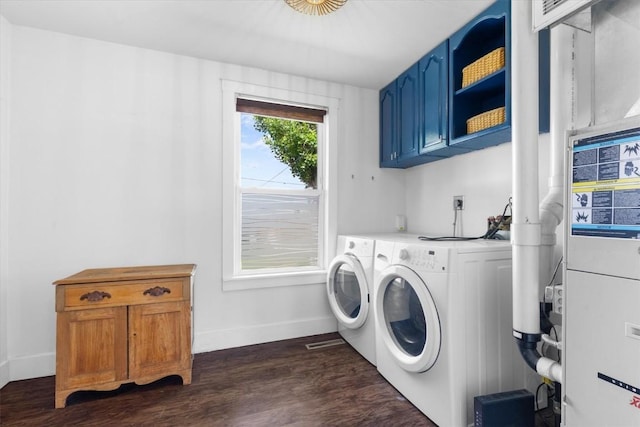 225 N Poplar St, Hayden, CO 81639 - washroom with cabinet space, separate washer and dryer, baseboards, and dark wood-type flooring