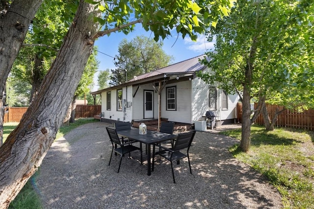 225 N Poplar St, Hayden, CO 81639 - fenced backyard with grilling area, a patio area, and outdoor dining area