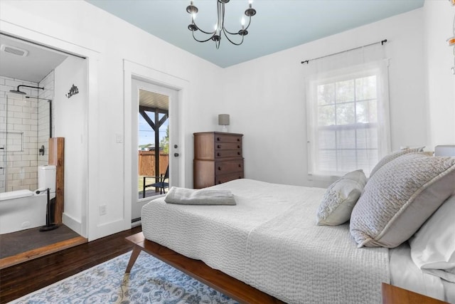 225 N Poplar St, Hayden, CO 81639 - bedroom with wood finished floors, access to outside, a chandelier, and ensuite bath