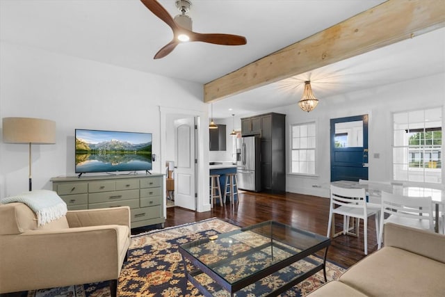 225 N Poplar St, Hayden, CO 81639 - living room with dark wood-style flooring, beamed ceiling, a ceiling fan, and a chandelier