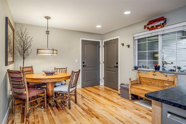 dining area with baseboards, recessed lighting, and light wood-type flooring