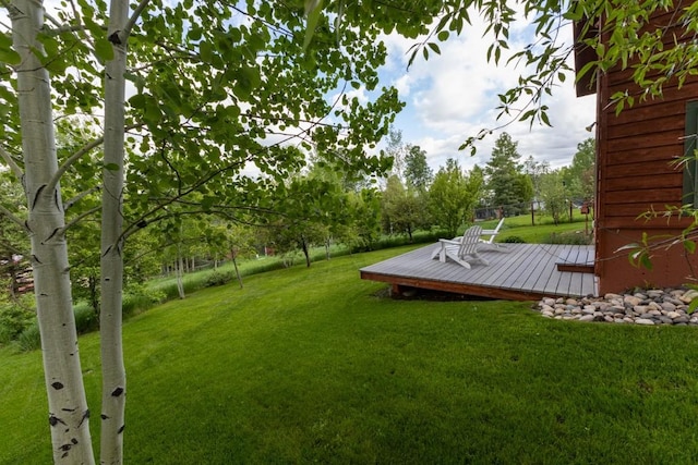 1763 Brome Dr, Steamboat Springs, CO 80487 - view of green lawn featuring a wooden deck