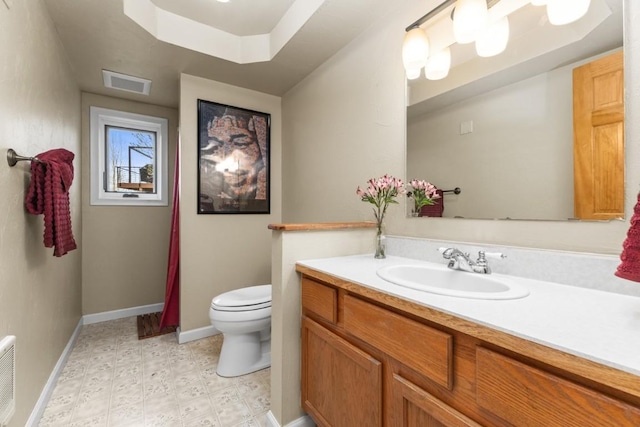 1763 Brome Dr, Steamboat Springs, CO 80487 - bathroom featuring toilet, baseboards, vanity, and tile patterned floors