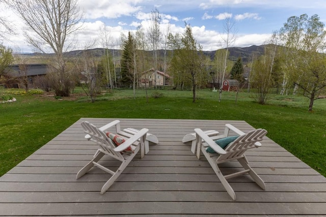 1763 Brome Dr, Steamboat Springs, CO 80487 - deck with a mountain view and a lawn