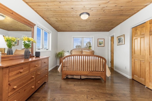 1763 Brome Dr, Steamboat Springs, CO 80487 - bedroom with wooden ceiling, baseboards, and dark wood-style floors