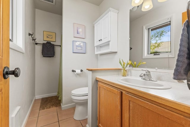 1763 Brome Dr, Steamboat Springs, CO 80487 - bathroom with toilet, tile patterned floors, vanity, and baseboards