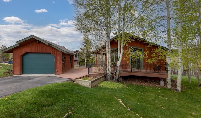 1763 Brome Dr, Steamboat Springs, CO 80487 - view of home's exterior featuring a lawn and asphalt driveway